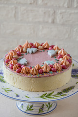 homemade cake for a children's party stand on a light background
