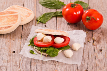 Tigella bread with spinach and tomatoes. 