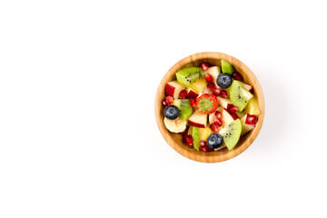 Fruit Salad in Wooden Bowl on White Table, Top View, copy space
