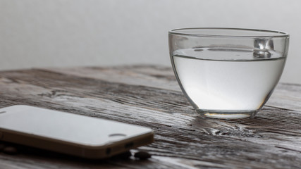 Vintage filter : Cold glass of water on wooden table