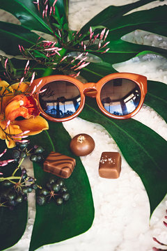 Chocolate, flower and sunglasses display