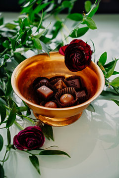 Pralines in brass bowl