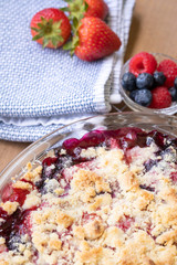 Close up on a freshly baked berry buckle, in a food background