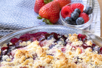 Close up on a freshly baked spring berry cobbler, in a food background