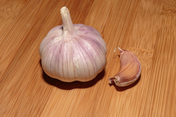Head of a garlic on the cutting board. Harvest 2018.