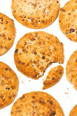 chocolate chip oatmeal cookies on white background. conceptual photo, vertical