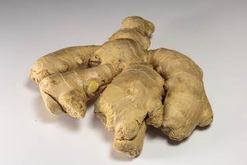 Ginger root on a white background, Asian food and popular Asian spice.