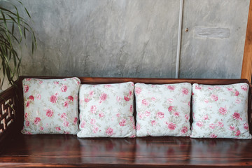 close up pillows on wooden chair :contemporary interior background concept.