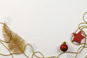 Christmas background with red and golden decorations on a white background.
