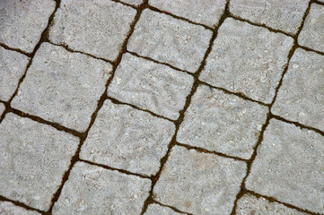 Square tile on the street, close-up