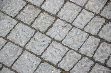 Decorative floor tiles in the street. Background Texture