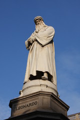 Monument to Leonardo Da Vinci with details around his statue on Piazza Della Scala in Milan, Italy.
