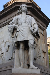 Monument to Leonardo Da Vinci with details around his statue on Piazza Della Scala in Milan, Italy.