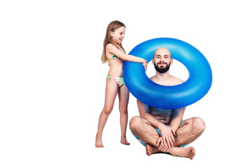 Fototapeta premium Happy bearded father and little girl with inflatable circle isolated on white background