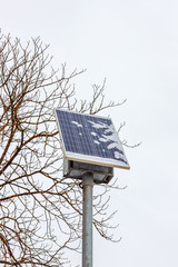 The snow-covered photovoltaic solar panel at the winter blizzard time. The problem of the solar power generation in north countries concept