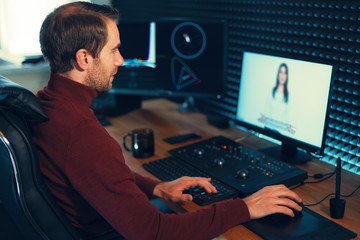 Male Videographer Edits and Cuts Footage and Sound on His Person