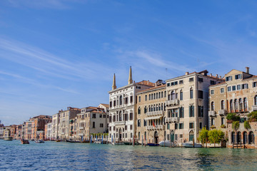 Scenic view of wide channel (Grand channel) and colorful houses in ancient touristic town Venice in Italy