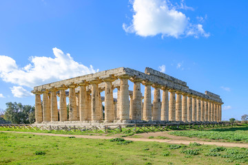 Fototapeta premium Scenic view of ruins of ancient greek temple in ancient touristic town Paestum in Italy