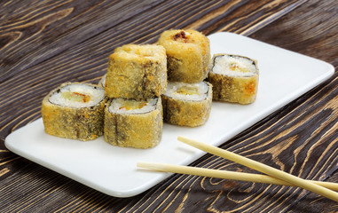 Japanese rolls, sushi on wooden background