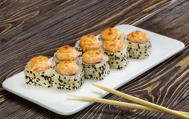Japanese rolls, sushi on wooden background