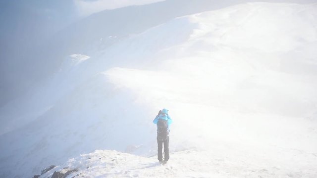 People mountain hiking in winter season on a beautiful day
