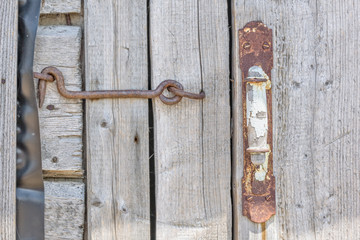 Door of the boards of the old barn, close-up