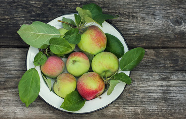 Organic apples on wooden table
