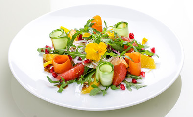 Fitness salad with orange, grapefruit and pomegranate