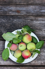 Organic apples on wooden table