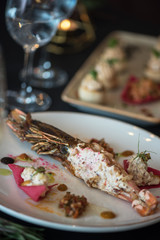 Cooked and stuffed crayfish on the table. Tasty restaurant dish
