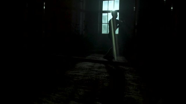 man training fighting. martial arts. battle with shadow near window slow motion