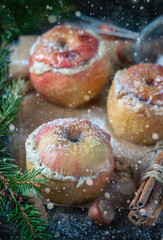 Baked apples with curd, honey and nuts  in the oven, closeup