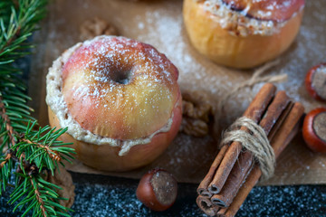 Baked apples with curd, honey and nuts  in the oven, closeup
