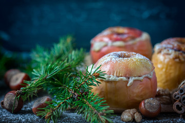 Baked apples with curd, honey and nuts  in the oven, closeup