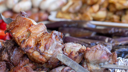 Street food, grilled meat on a spit. Homemade.