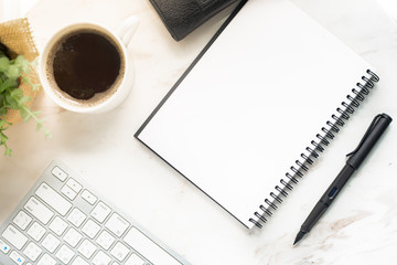 Home office workspace mockup with laptop, notebook and accessories on white background. Flat lay, top view