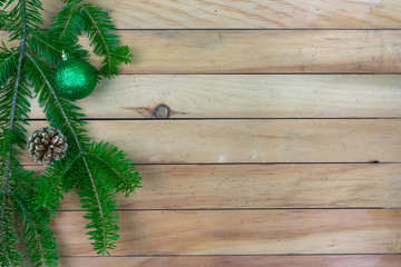 Greenery, green ornament,  and pine cone left side border with copy space
