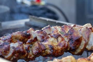 Street food, grilled meat on a spit. Homemade.
