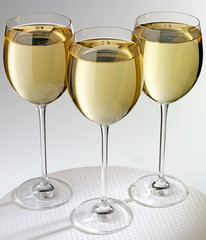 THREE GLASSES OF WHITE WINE