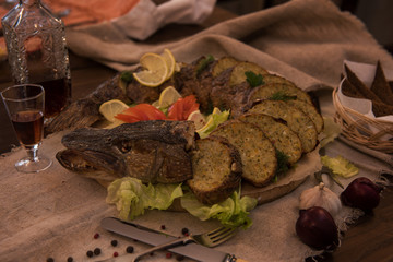 Stuffed pike with vegetables and greens. Russian food