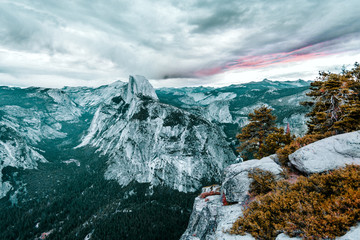 Clouds hovering over mountains