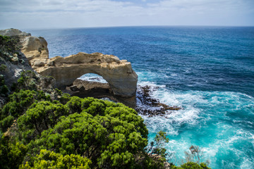 Travel Victoria, Australia. Beautiful view of the London Arch, tourist popular attraction/stop on Great Ocean Road near Melbourne and Twelve Apostles. Bright colours, clear summer day.