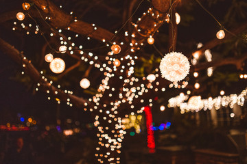 Bright lights wrapped around a tree