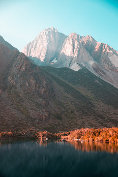 A lake surrounded by large mountains