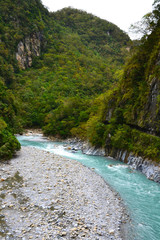 Travel Taiwan, Asia. Beautiful turquoise river water at Taroko Gorge, National Park. Summer, rainy season. Landscape, travel background.