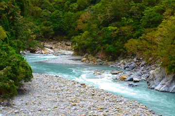 Travel Taiwan, Asia. Beautiful turquoise river water at Taroko Gorge, National Park. Summer, rainy season. Landscape, travel background.