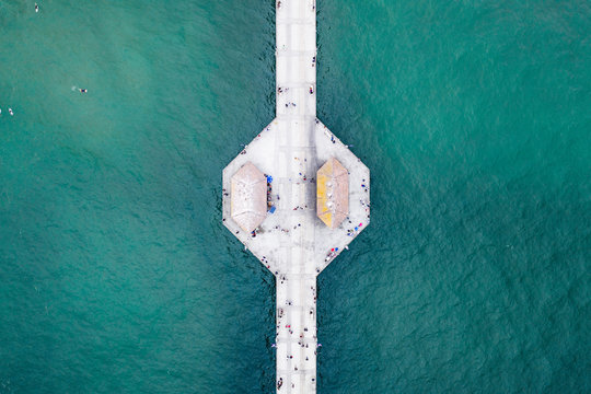 Fototapeta Aerial view of pier on sea