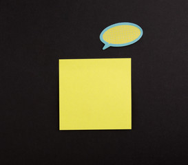 Yellow Blank Sticky Note on black background , One big paper sheet background. Copy Space. dialogue...