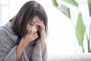 woman sick and sneeze