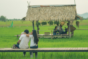 Asian people relax and take a photography on wooden bridge in th